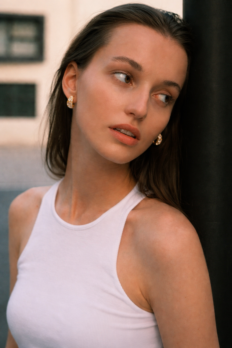 Earrings on brown silk background