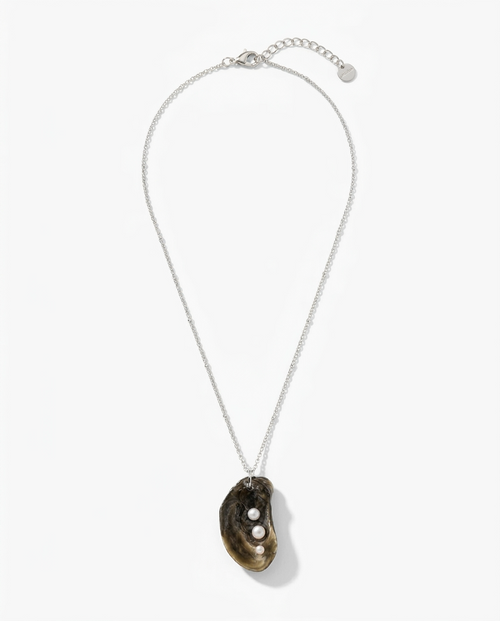 A silver chain necklace featuring a natural mussels shell pendant with three small white pearls, displayed on a clean white background.